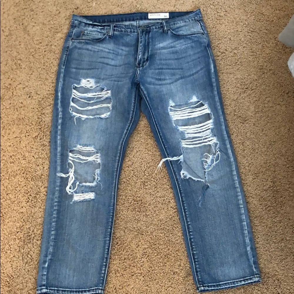 Distressed boyfriend jeans.